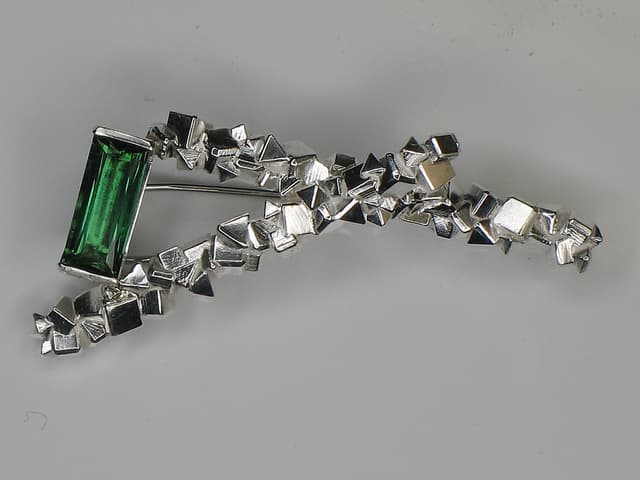 silver brooch with tourmaline